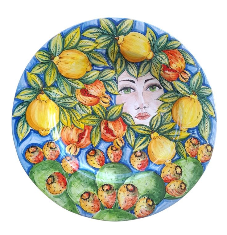 Piatto da parete con composizione di frutta e volto